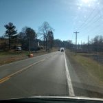 A community service volunteer cleans up a stretch of highway adopted by Judge Cannon under the Adopt-A-Highway program.