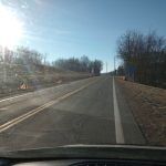 A community service volunteer cleans up a stretch of highway adopted by Judge Cannon under the Adopt-A-Highway program.