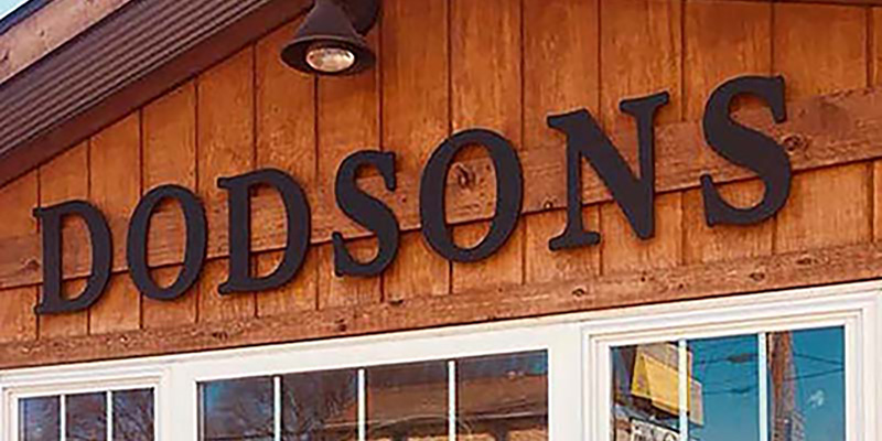 Exterior shot of the sign for the restaurant Dodson's on Broadway.