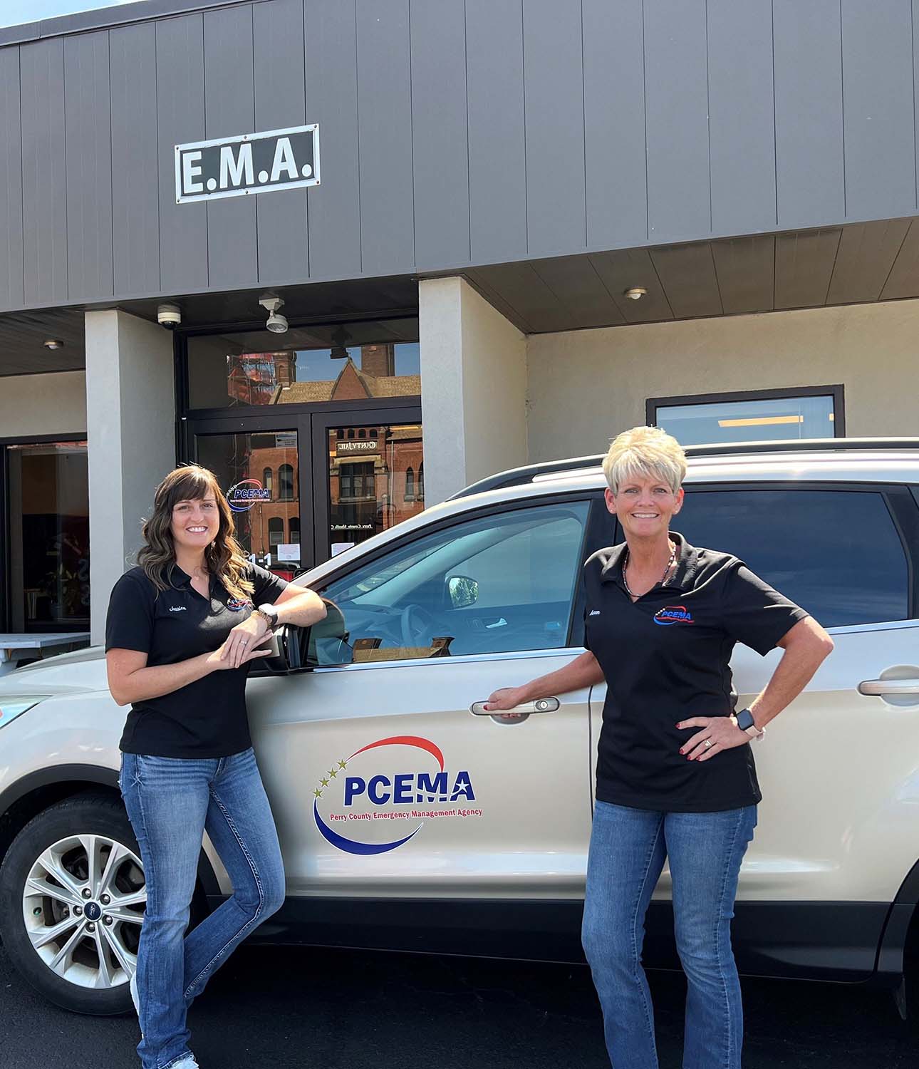 Two team members in front of the Perry County Emergency Management office.