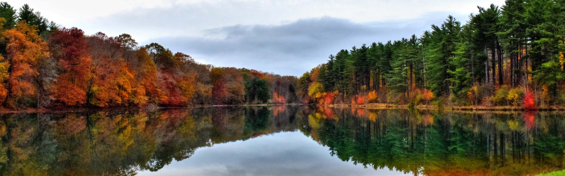 Fall scene at lake with color-changing trees in Perry County, Ohio's Park District